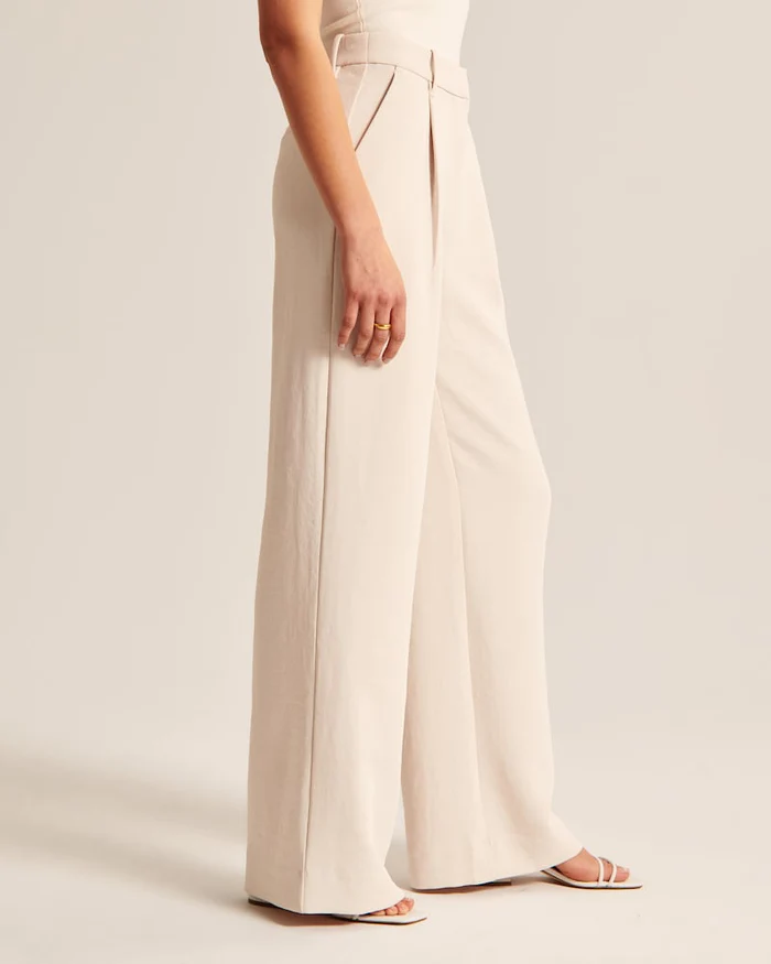 Paola - Getailleerde broek met wijde pijpen in beige